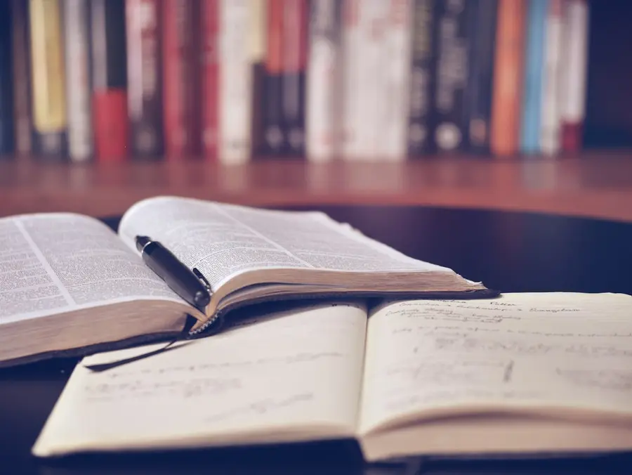 Open books on a wooden desk